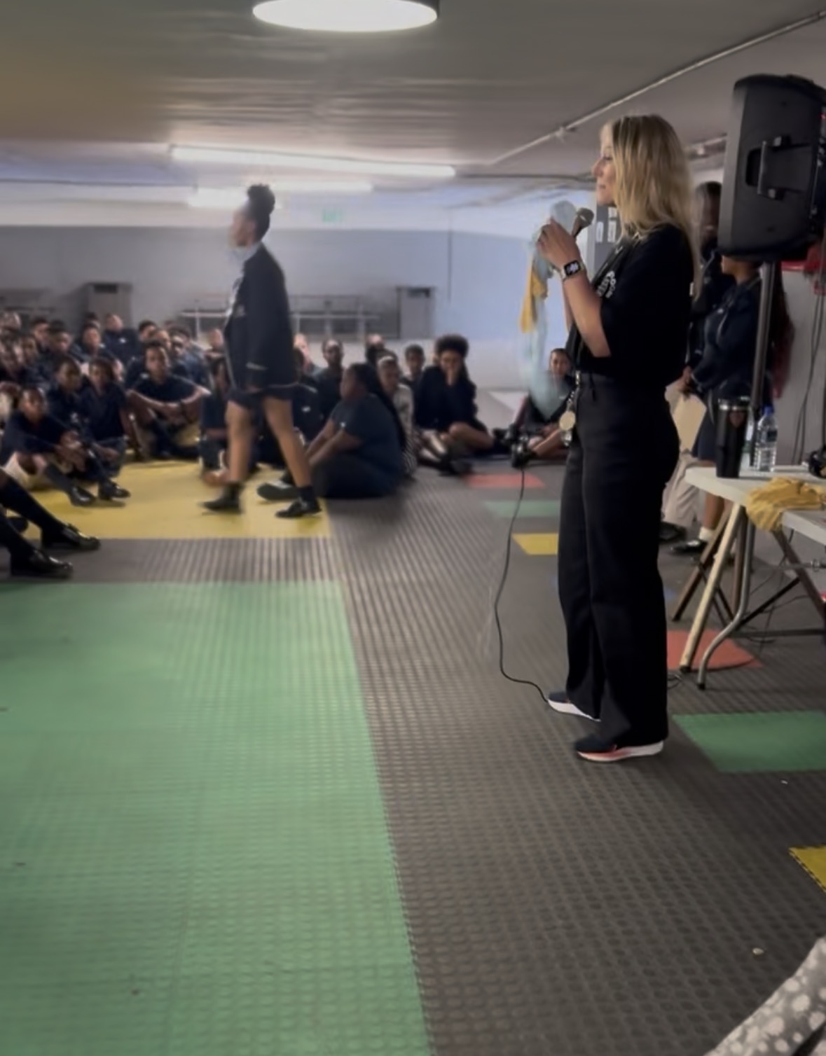 Talitha speaking at a school event
